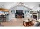 Spacious living room featuring a fireplace, skylights, and a vaulted ceiling, creating a cozy atmosphere at 90 Hazelridge Ln, Sharpsburg, GA 30277