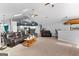 Spacious living room featuring comfortable seating, an open floor plan, and modern lighting at 90 Hazelridge Ln, Sharpsburg, GA 30277