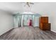 Well-lit living space featuring modern flooring, neutral paint, and a compact kitchenette at 90 Hazelridge Ln, Sharpsburg, GA 30277