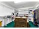Organized walk-in closet with shelving, hanging rods, and storage baskets at 90 Hazelridge Ln, Sharpsburg, GA 30277