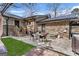 The backyard features a patio area with tables, chairs and a bench at 100 Cross Plains Hulett Rd, Carrollton, GA 30116