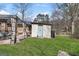 Cozy backyard featuring a pergola, patio furniture, and a shed, perfect for storage or hobbies at 100 Cross Plains Hulett Rd, Carrollton, GA 30116