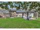 View of backyard with a patio area and covered pergola with an outdoor seating area at 100 Cross Plains Hulett Rd, Carrollton, GA 30116