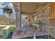 Charming brick front porch, decorated with potted plants and inviting outdoor furniture at 100 Cross Plains Hulett Rd, Carrollton, GA 30116