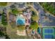 Aerial view of community amenities: pool, tennis, clubhouse, playground, sand volleyball and parking at 5808 Deer Crossing Dr, Sugar Hill, GA 30518
