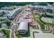 Aerial showing the mix of residential apartments and retail spaces in a neighborhood setting at 5808 Deer Crossing Dr, Sugar Hill, GA 30518