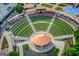Stunning aerial view of The Bowl at Sugar Hill, showcasing its unique amphitheater design and surrounding green spaces at 5808 Deer Crossing Dr, Sugar Hill, GA 30518