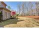Spacious backyard with a lush lawn and wooded area offers a private outdoor retreat at 5808 Deer Crossing Dr, Sugar Hill, GA 30518