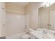 Bright bathroom with white tiled shower and vanity at 5808 Deer Crossing Dr, Sugar Hill, GA 30518