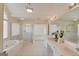 Bathroom with a whirlpool tub and large mirror at 5808 Deer Crossing Dr, Sugar Hill, GA 30518