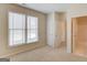 Bedroom with 2 large windows, and carpet at 5808 Deer Crossing Dr, Sugar Hill, GA 30518