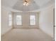 Empty bedroom with a ceiling fan and carpeted floor at 5808 Deer Crossing Dr, Sugar Hill, GA 30518