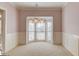 Bright and airy dining area featuring a bay window and wainscoting, perfect for Gathering gatherings at 5808 Deer Crossing Dr, Sugar Hill, GA 30518