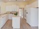 Kitchen with a center island and white cabinetry at 5808 Deer Crossing Dr, Sugar Hill, GA 30518