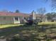 Spacious backyard featuring a deck and ample green space, perfect for recreation at 222 Farmbrook Pkwy, Stockbridge, GA 30281