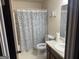 Neutral bathroom featuring a tile floor, sink and toilet at 222 Farmbrook Pkwy, Stockbridge, GA 30281