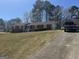 Charming brick home with manicured lawn and driveway, perfect for suburban living at 222 Farmbrook Pkwy, Stockbridge, GA 30281