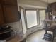 Traditional kitchen boasts natural light from a large bay window and offers eat-in nook at 222 Farmbrook Pkwy, Stockbridge, GA 30281