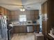 An eat-in kitchen featuring stainless steel appliances and custom wood cabinets at 222 Farmbrook Pkwy, Stockbridge, GA 30281