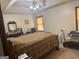Main bedroom showcasing a decorative mirror, fan with lights and a neutral color palette at 222 Farmbrook Pkwy, Stockbridge, GA 30281
