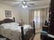 This bedroom features a wooden bedframe, plush carpets and curtains at 222 Farmbrook Pkwy, Stockbridge, GA 30281
