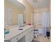 Well-lit bathroom with a white vanity, bathtub/shower combo, and neutral-toned walls and flooring at 1475 Keystone Dr, Suwanee, GA 30024