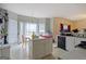 Bright kitchen with an island, view of the backyard through the large windows and table at 1475 Keystone Dr, Suwanee, GA 30024