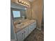 Bathroom with double sink vanity, large mirror and tile flooring at 1222 Snapping Shoals Rd, Mcdonough, GA 30252