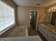 Bathroom with double sink vanity, soaking tub and window at 1222 Snapping Shoals Rd, Mcdonough, GA 30252