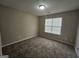 A standard empty bedroom with carpet flooring at 1222 Snapping Shoals Rd, Mcdonough, GA 30252