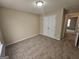 Neutral bedroom with plush carpet, double closet, and ample natural light at 1222 Snapping Shoals Rd, Mcdonough, GA 30252