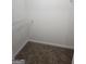 Carpeted walk-in closet with a single installed shelf at 1222 Snapping Shoals Rd, Mcdonough, GA 30252