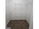 Walk in closet with carpet flooring and installed white shelving at 1222 Snapping Shoals Rd, Mcdonough, GA 30252
