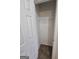 Small walk-in closet with carpeted floor and one wire rack at 1222 Snapping Shoals Rd, Mcdonough, GA 30252
