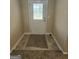Inviting entryway with a decorative glass door, tile flooring, and a cozy rug at 1222 Snapping Shoals Rd, Mcdonough, GA 30252