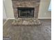 Cozy stone fireplace adds character and warmth to the living space at 1222 Snapping Shoals Rd, Mcdonough, GA 30252