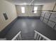 Clean garage with epoxy floor, bright lighting, and ample space for vehicles at 1222 Snapping Shoals Rd, Mcdonough, GA 30252