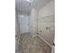Laundry room with tile flooring, utility sink hookups and shelving at 1222 Snapping Shoals Rd, Mcdonough, GA 30252
