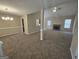 Spacious living room featuring neutral walls, cozy carpet, and a fireplace for a warm ambiance at 1222 Snapping Shoals Rd, Mcdonough, GA 30252