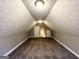 Finished attic with carpeted floors and two separate closet doors at 596 Carlton Rd, Palmetto, GA 30268