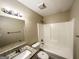 Cozy bathroom featuring a white vanity with granite countertops, toilet, and tiled shower at 596 Carlton Rd, Palmetto, GA 30268