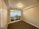 Bedroom with a large window, carpeted floors, neutral paint, and crown molding at 596 Carlton Rd, Palmetto, GA 30268