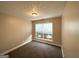 Bedroom with carpeted floors and a bright window with venetian blinds at 596 Carlton Rd, Palmetto, GA 30268