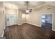 Spacious living area with modern wood flooring, ceiling fan, and a view of the entry at 596 Carlton Rd, Palmetto, GA 30268