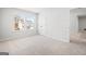 Bright bedroom featuring a window and closet with plush carpeting and neutral paint, creating a serene atmosphere at 1619 Tide Mill Rd, Cumming, GA 30040