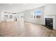Open-concept floorplan seamlessly connects the living room with fireplace to the modern kitchen at 1619 Tide Mill Rd, Cumming, GA 30040