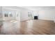 Living room with fireplace, wood-look flooring, and large windows at 1619 Tide Mill Rd, Cumming, GA 30040