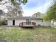 Exterior view of the back of home and a wooden deck at 6635 Hidden Brook Trl, South Fulton, GA 30349