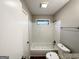 Bathroom features a shower and tub combination with tile surround at 6635 Hidden Brook Trl, South Fulton, GA 30349