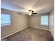 Bedroom features carpeting, ceiling fan, and two large windows at 6635 Hidden Brook Trl, South Fulton, GA 30349